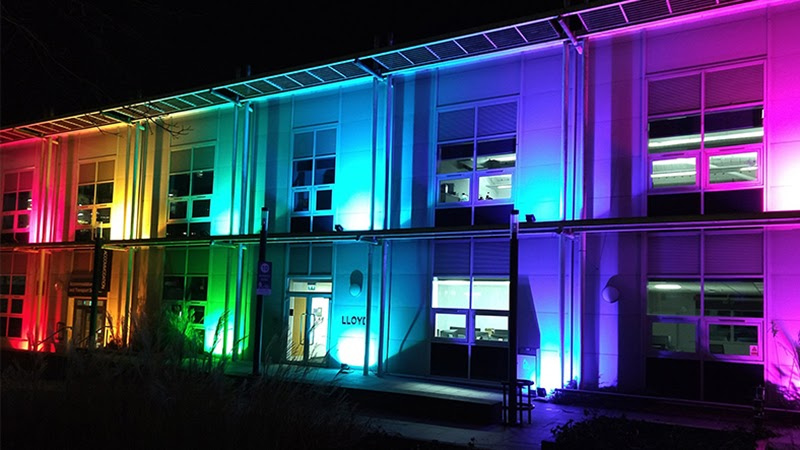 Lloyd building lit up in Pride Flag colours for LGBTQ+ history month